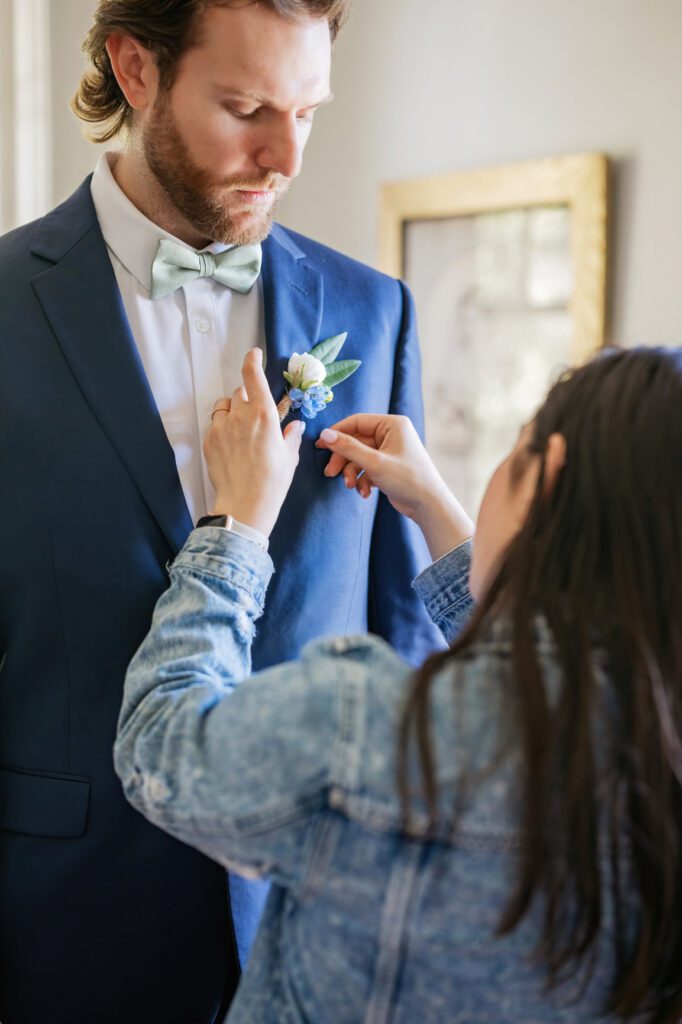 Raleigh wedding planner assisting groom 