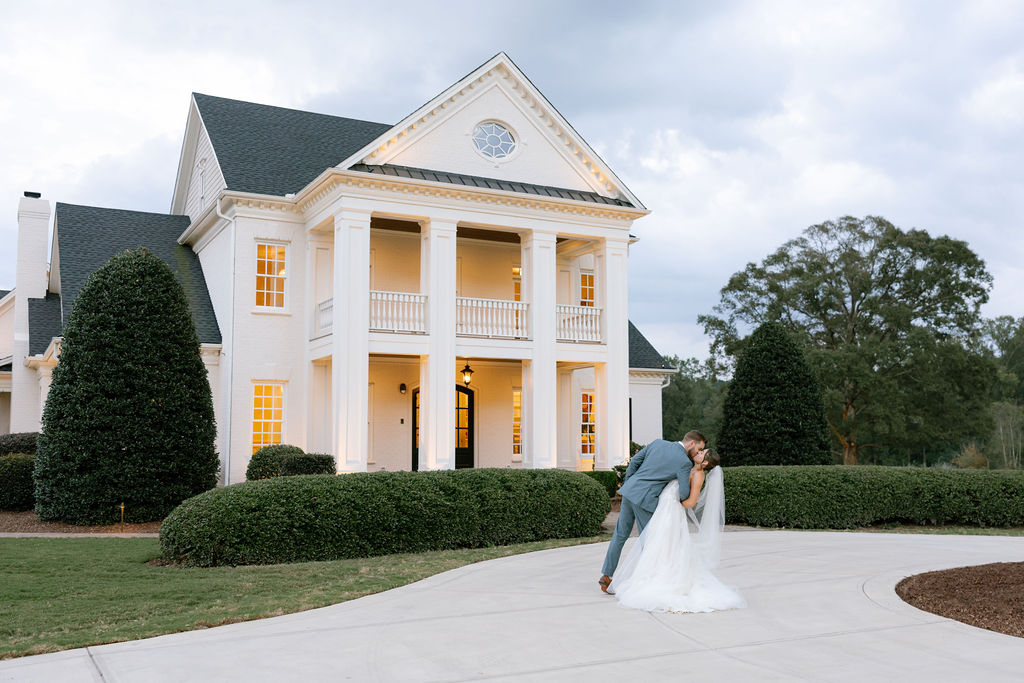 Couple Kiss in front of Raleigh Wedding Venue