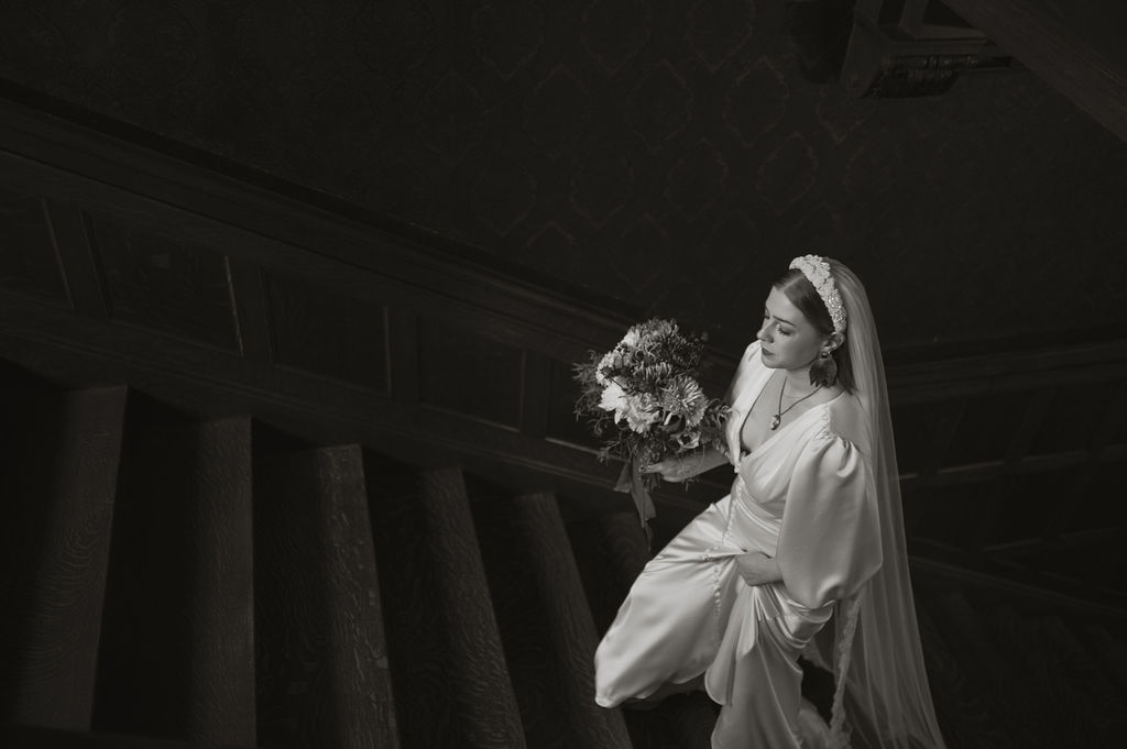 Bride ascending steps for her wedding at Hill House Durham